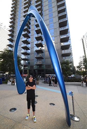 Jonathan Paul, aka Desire Obtain Cherish, with his 'Lucky Break' sculpture in Downtown LA in Oct, 2019.
